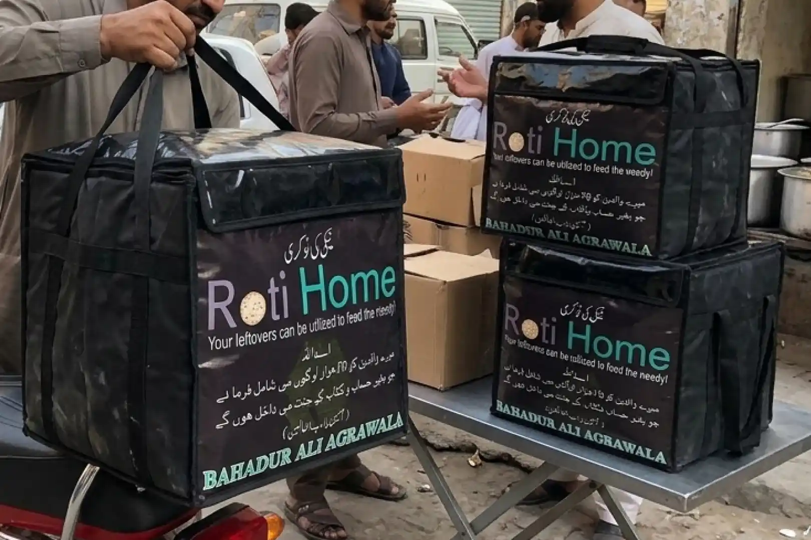 Roti Home collection bags carrying a message about using leftover food to help people in need